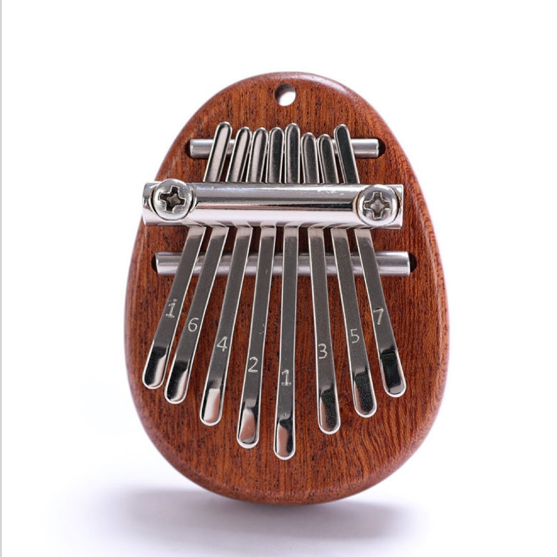 Portable thumb piano