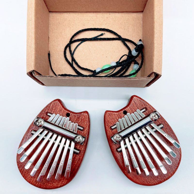 Portable thumb piano